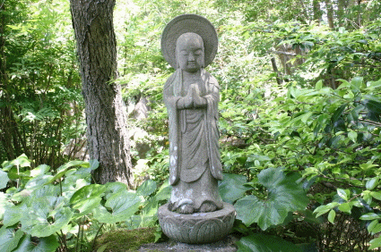 Jizo statue in Buddhist temple garden, © Yasuko Takemoto 2005, iStockphoto