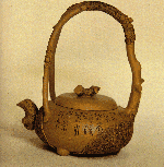 Unusual Yixing teapot with naturalistic overhandle